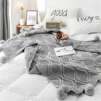 PLAID BOHEME TRICOTE A POMPONS  – DOUCEUR ET CONFORT